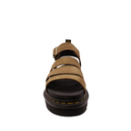 Front toe view of Savannah Tan Nubuck Blair Dr. Martens Sandal. Yellow stitching of sole, black and yellow pull tab on heel. Gold Buckle on ankle strap. Three over the top of the foot straps. Shop Womens Dr. Marten Sandals Online and in-store with shoe&me Mount Maunganui.
