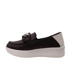 Side angled view of black slip on shoe called mafia from Alfie & Evie. Black leather laced in silver chain decorating the top, white leather heel with a white sole. Shop Alfie & Evie Womens Shoes online and In-Store with shoe&me Mount Maunganui.