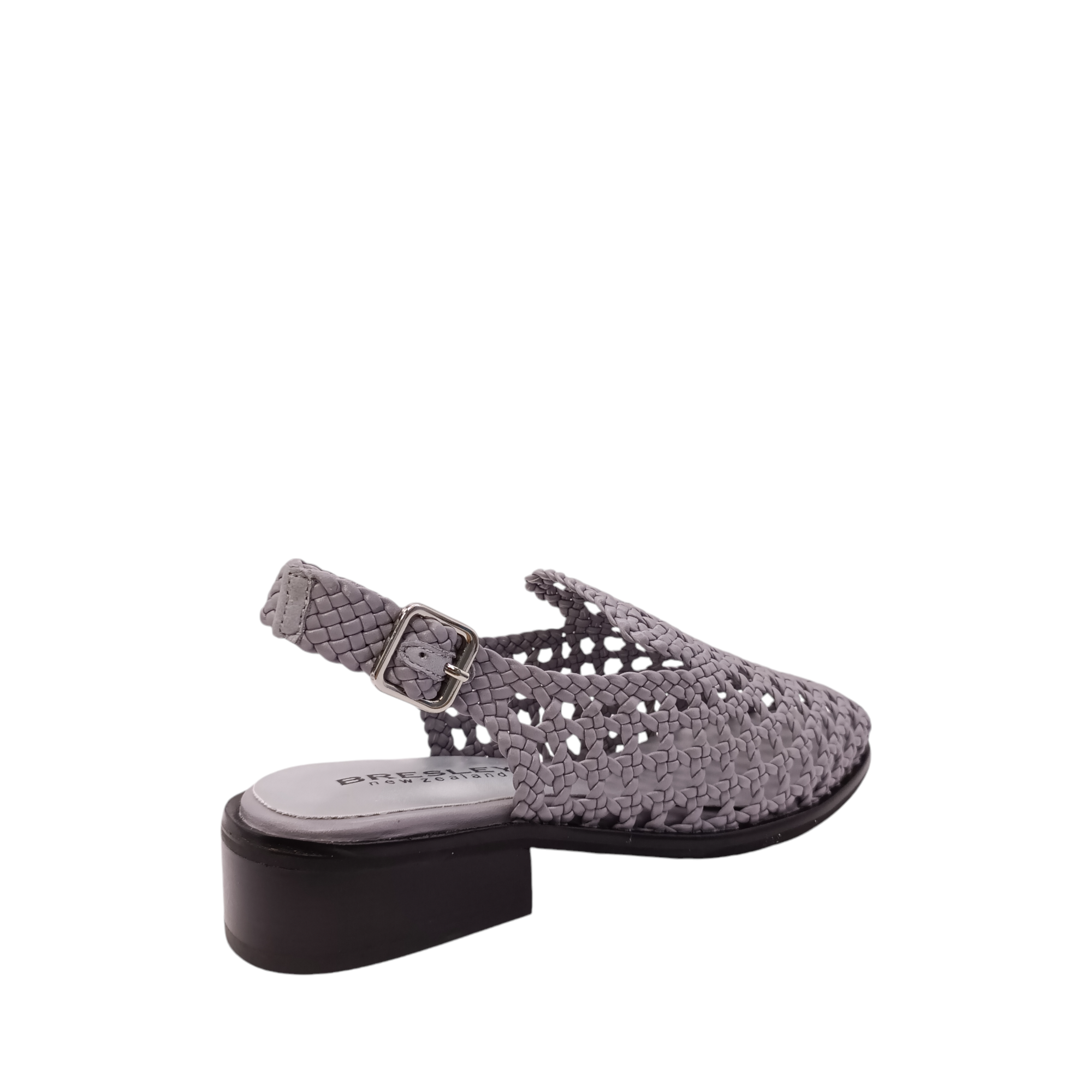 Back side angled view of Apin from Bresley. Grey leather slide with a small black heel. A weaved upper  with an adjustable back strap and a closed in toe. Shop Womens Slip-on Slides online and in-store with shoe&me Mount Maunganui NZ