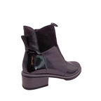 Shop Dread boot from Bresley. Back angled view of Black patent leather on the toe and the back heel. Heel loop at the top of ankle piece. suede pieces of leather around the boot. side zip and a gusset over the front. shoe&me Mount Maunganui