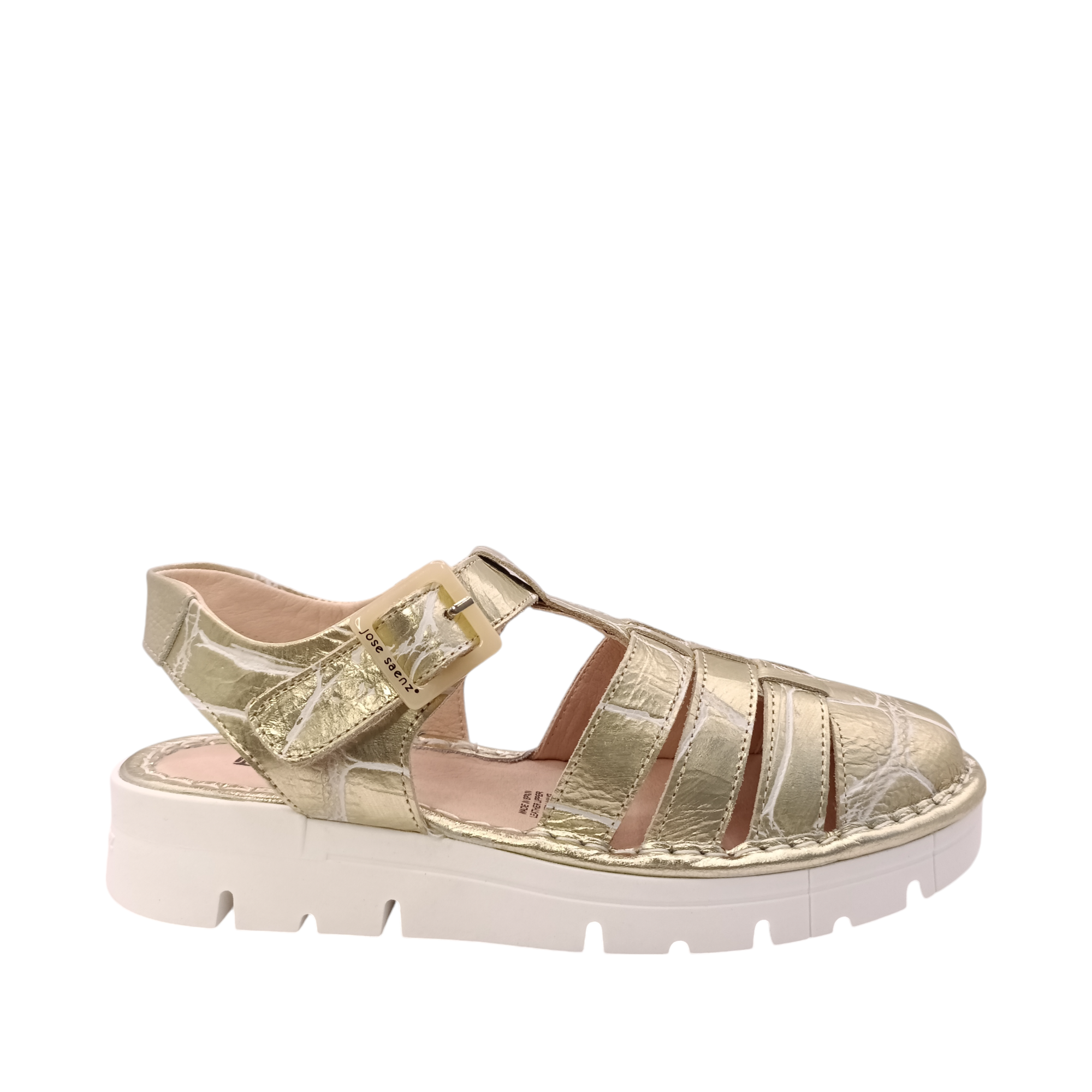 Side on view of the gold Jazz covered toe sandal from Jose Saenz. Gold leather sandal with a white distressed cracked look. Shop Womens Summer covered toe platform sandals online and in-store with shoe&me Mount Maunganui.