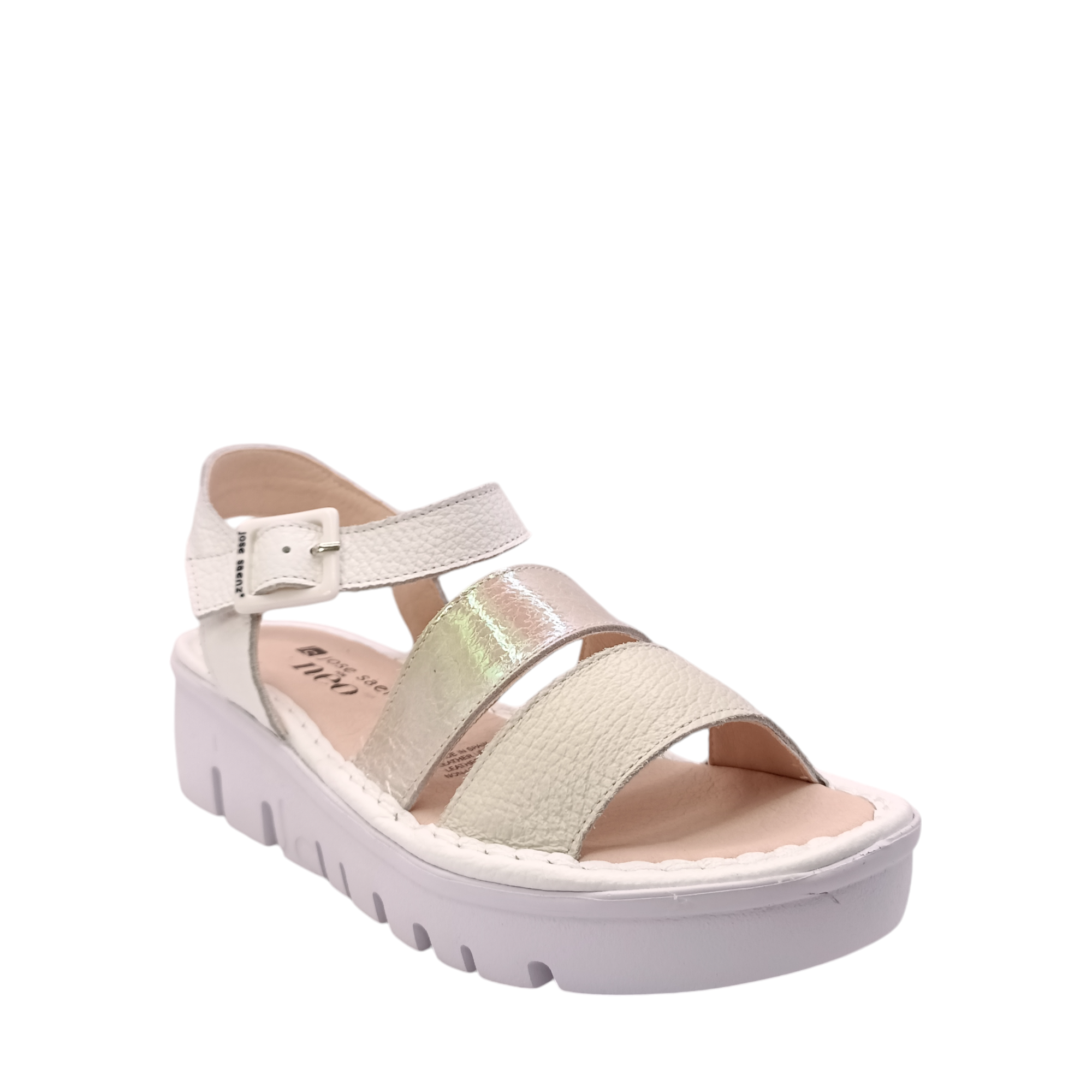 Front angled side view of the Julia Platform sandal from Jose Saenz. White ankle strap and beige leather upper over the toes on a leather footbed. A pearl coloured strap over the middle of the foot. White platform sole. Shop Womens Summer Platform Sandals online and in-store with shoe&me Mount Maunganui.