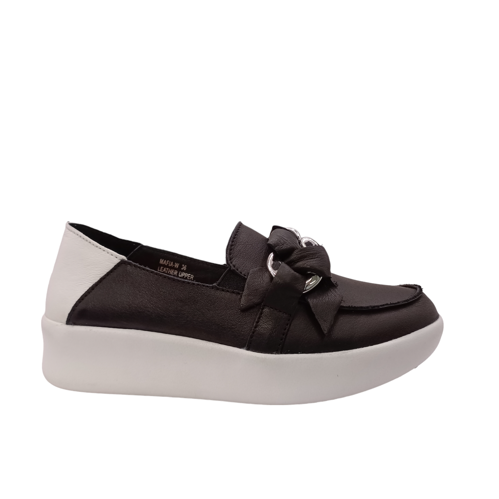 Side angled view of black slip on shoe called mafia from Alfie &amp; Evie. Black leather laced in silver chain decorating the top, white leather heel with a white sole. Shop Alfie &amp; Evie Womens Shoes online and In-Store with shoe&amp;me Mount Maunganui.