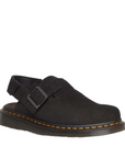 Front side view of Jorge II from Dr. Martens. Shop Black Suede Clogs with shoe&me. Suede footbed with a metal buckle over the top of the shoe. Velcro strap around the heel.